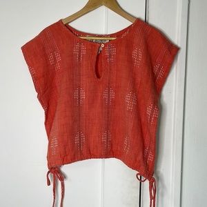 Sleeveless top with ties on the side